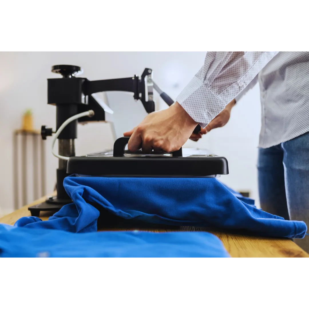 Close-up of a detailed design being screen printed onto a t-shirt.